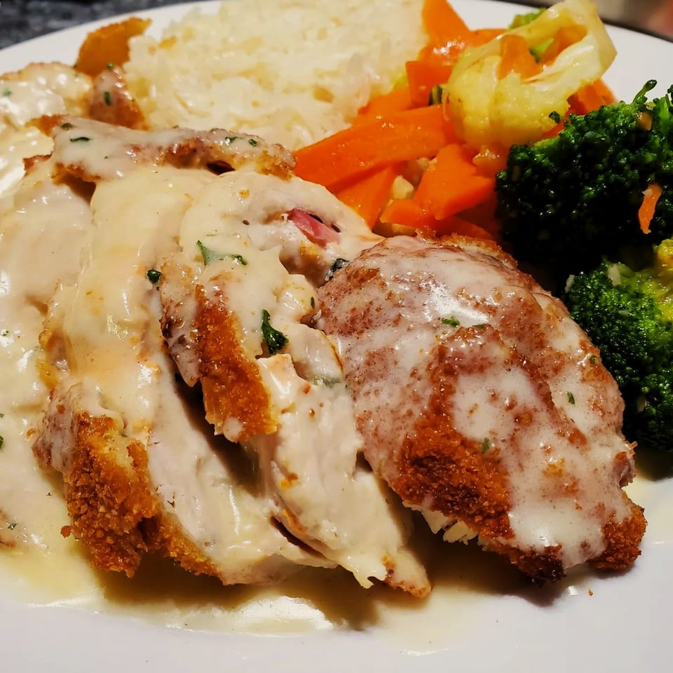 Viva Italiano Pizzeria's chicken cordon bleu with creamy sauce, rice, carrots, and broccoli.